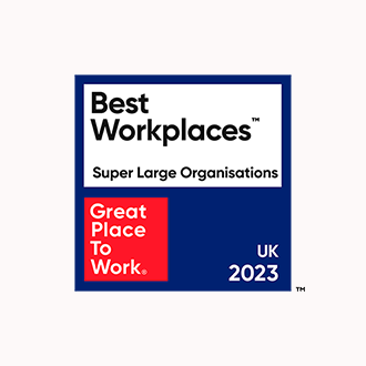 The logo of Great Places to Work. A blue background with overlaying text which reads Best Workplaces, Super Large Organisations - UK 2023.